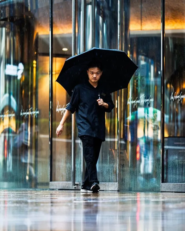 inclement weather visits hong kong- unfazed and focused, the people carry on